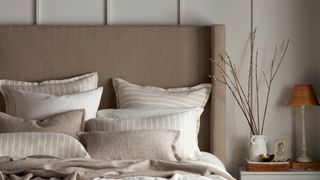 Neutral bedroom with upholstered headboard showing key bedroom trends 2023