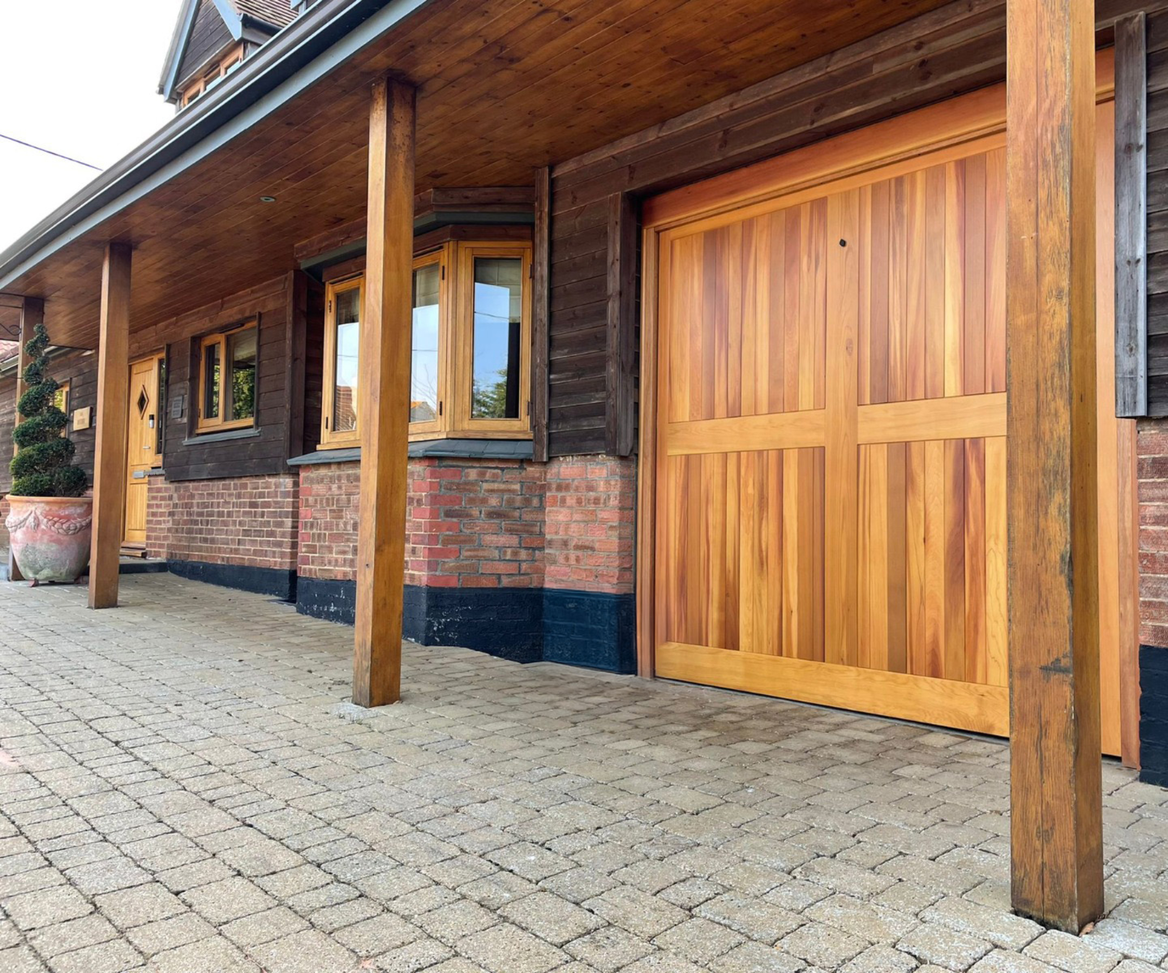 timber garage door on brick and timber property