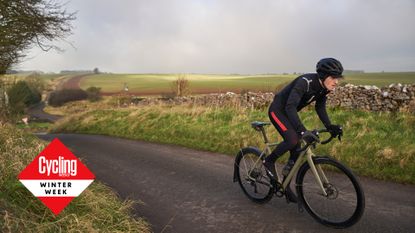 Image shows a cyclist riding a winter bike.