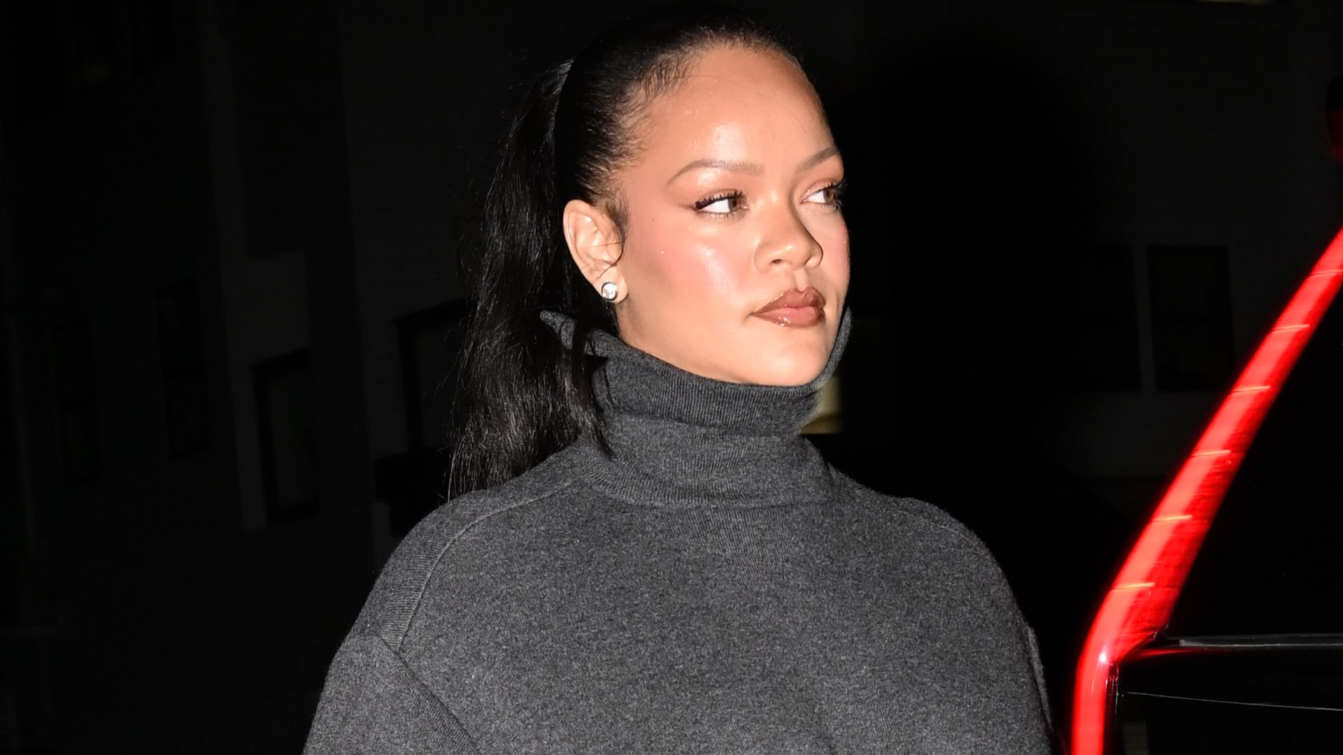 Rihanna was spotted in New York City wearing a high-low look with dark jeans and a rare Louis Vuitton tote bag