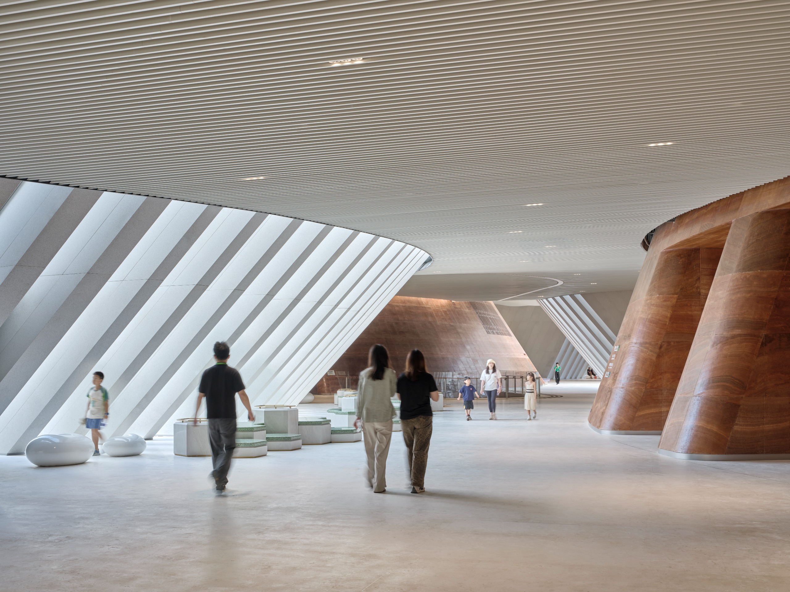 undulating forms of the Shenzhen Natural History Museum by 3XN, B+H Architects and Zhubo Design in a green park