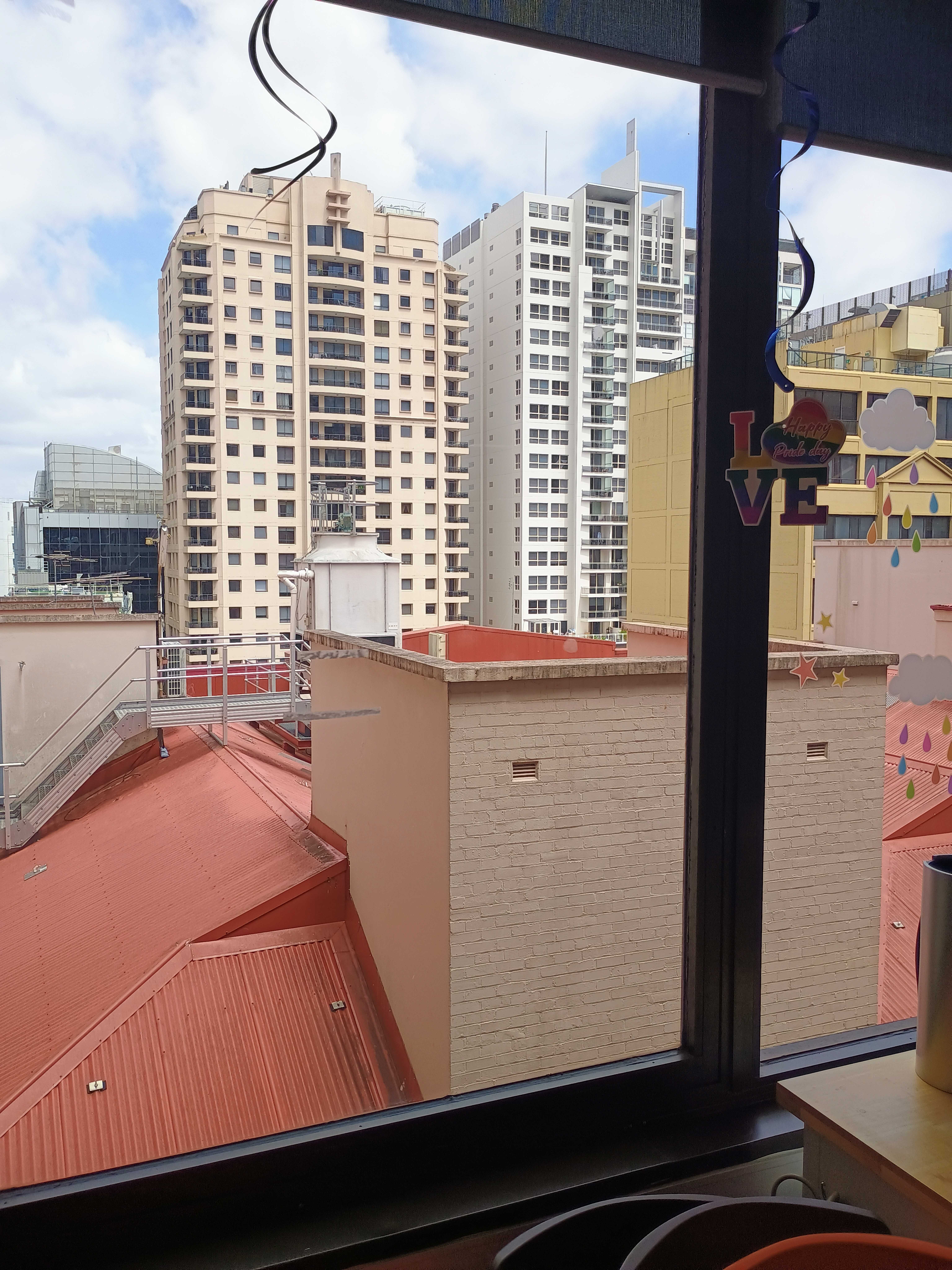 Image of cityscape taken through window using Moto G54 5G