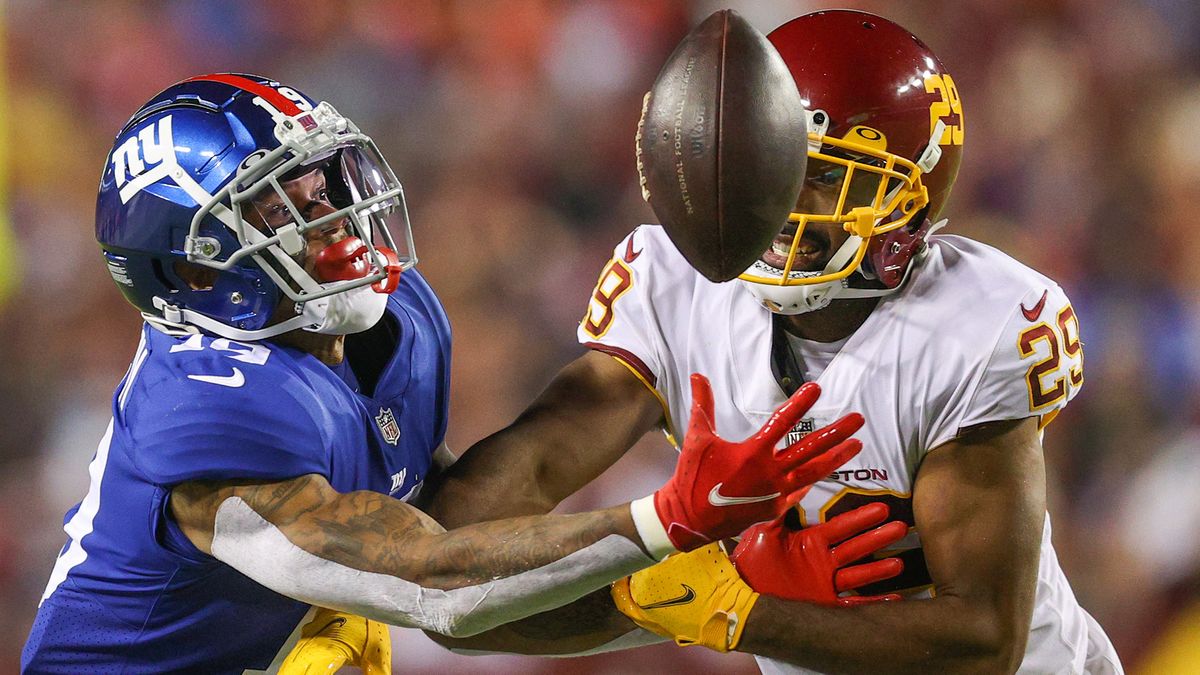 Kendall Fuller #29 of the Washington Football Team and Kenny Golladay #19 of the New York Giants unable to gain control of the ball during the third quarter at FedExField on Sept. 16, 2021 in Landover, Maryland.