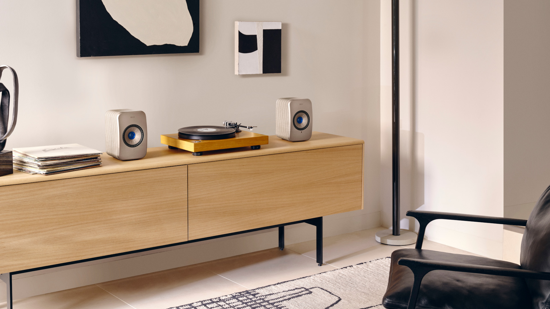 The KEF LSX II next to a turntable.