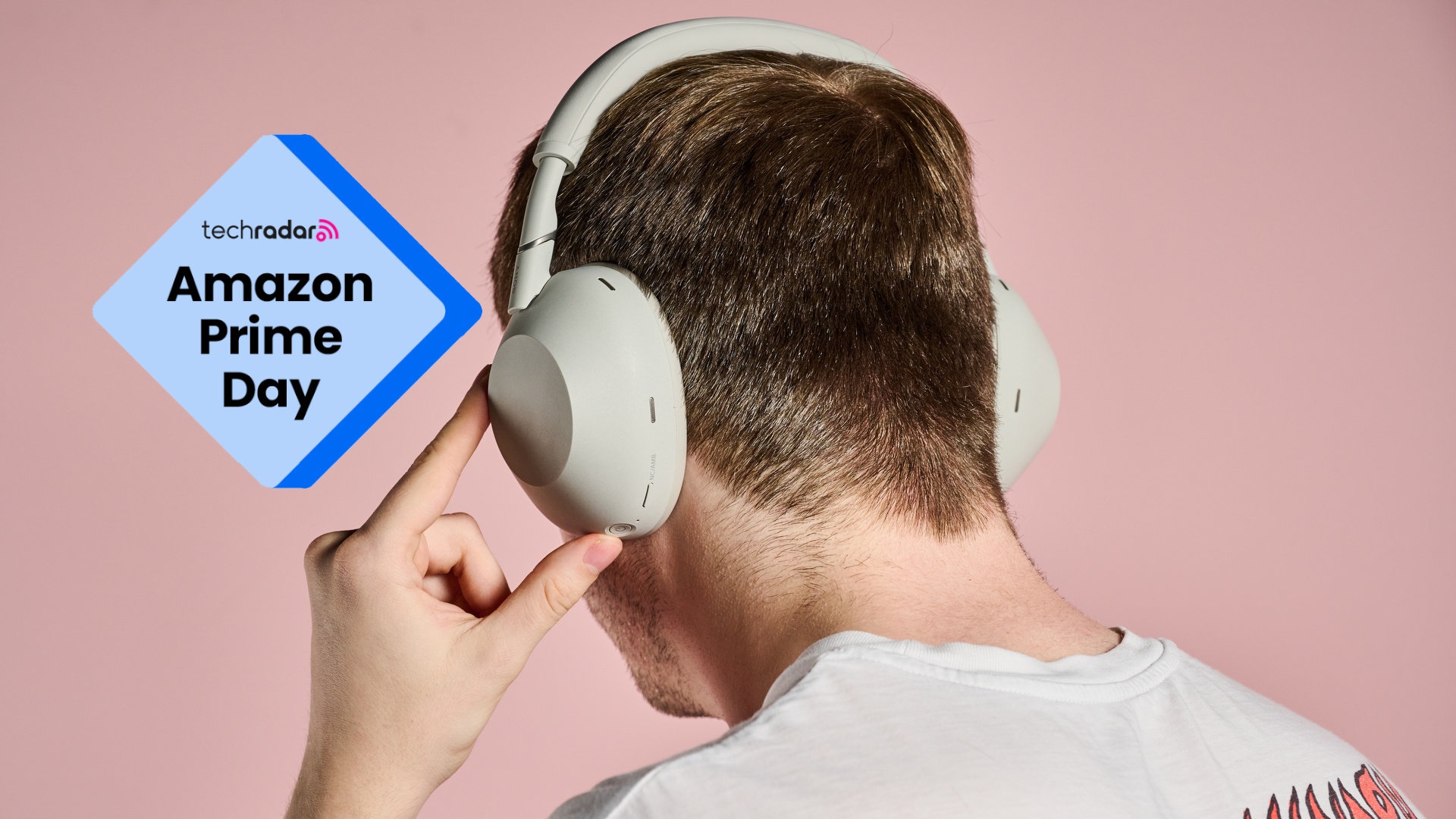 Man wearing Sony WH-1000XM6 with badge that reads 'TechRadar: Amazon Prime Day'