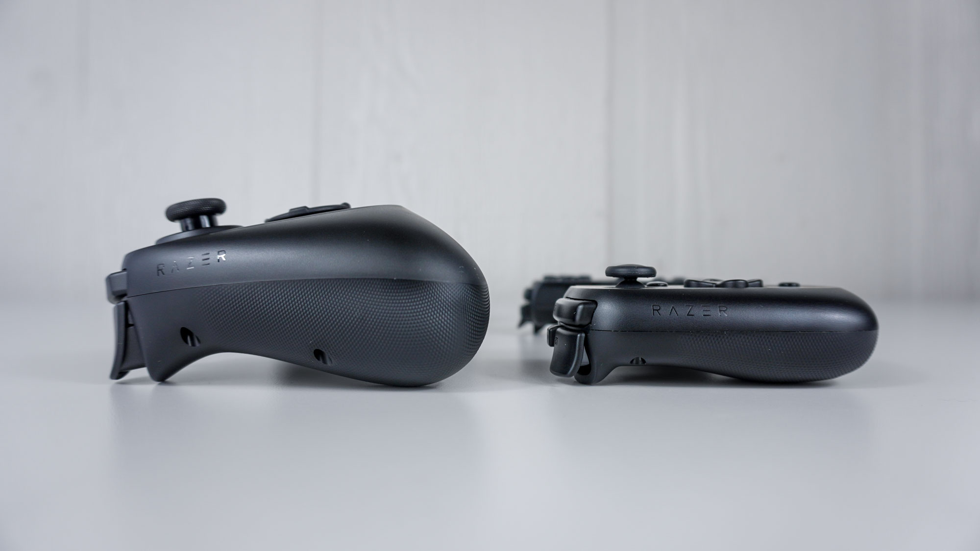 The Razer Kishi Ultra side by side with the Razer Kishi V2 on a table