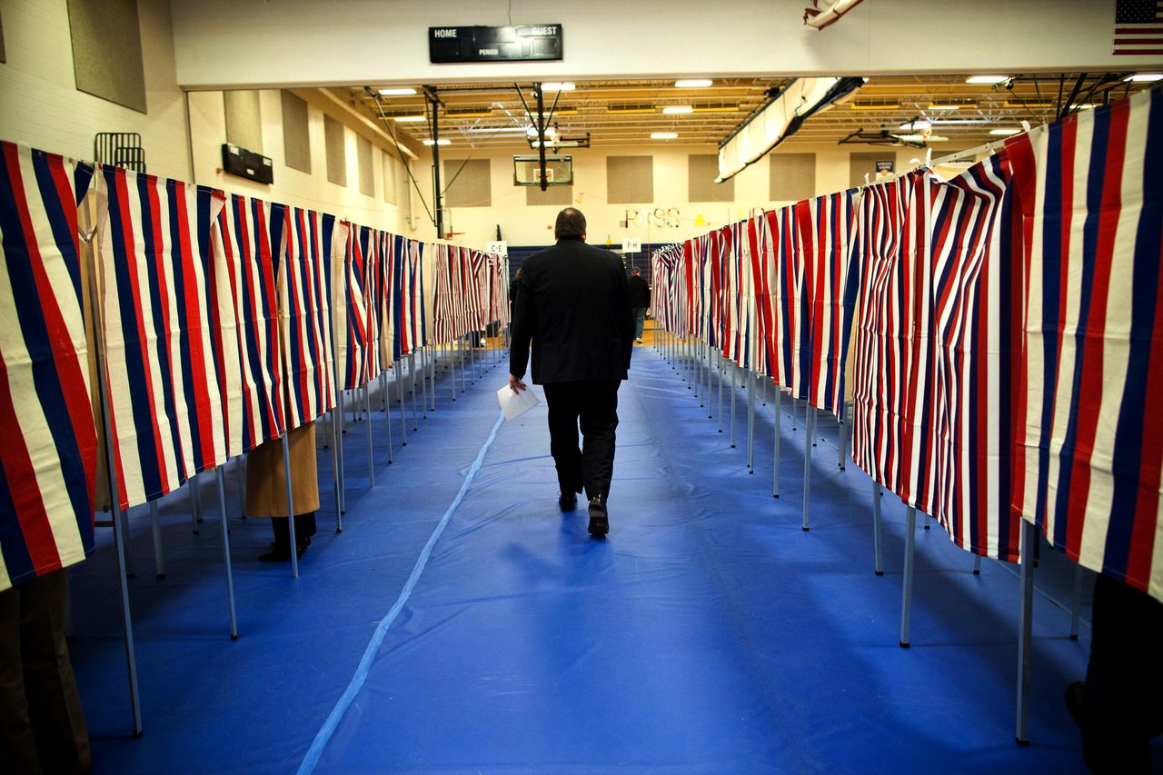 man walks past red white and blue voting booths but doesnt even have the constitutional right to vote!