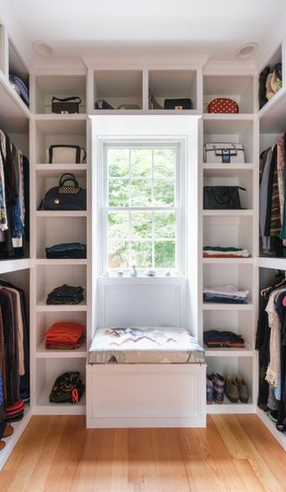 A closet with a windowsill featuring crystals