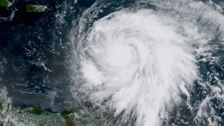 Hurricane Maria is seen by NOAA's GOES-13 satellite as the storm was located about 60 miles east of Martinique and moving toward the west-northwest near 10 mph on Sept. 18, 2017 at 11 a.m. EDT. At the time, Maria was a category 3 storm. It later strengthe