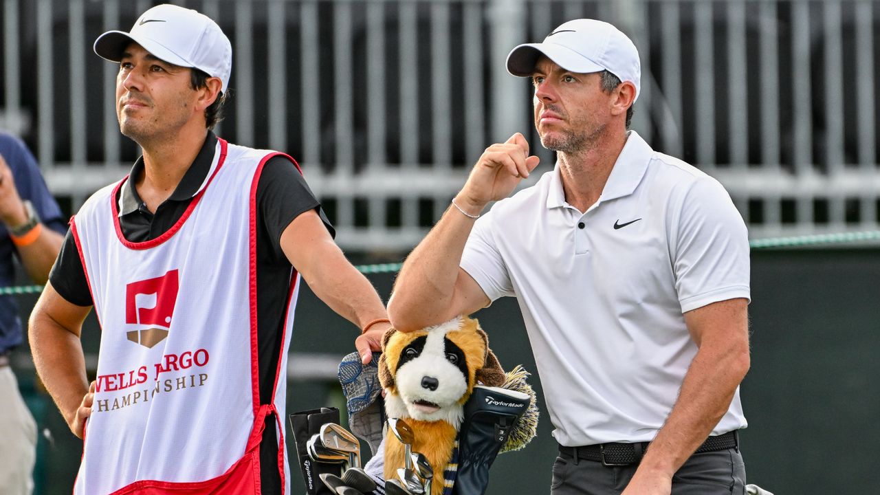 Rory McIlroy and caddie Harry Diamond wait for the group ahead at the Wells Fargo Championship