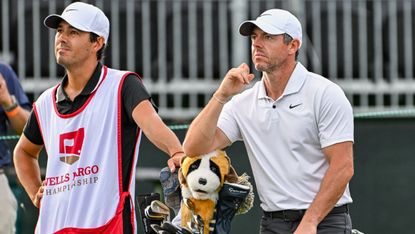 Rory McIlroy and caddie Harry Diamond wait for the group ahead at the Wells Fargo Championship