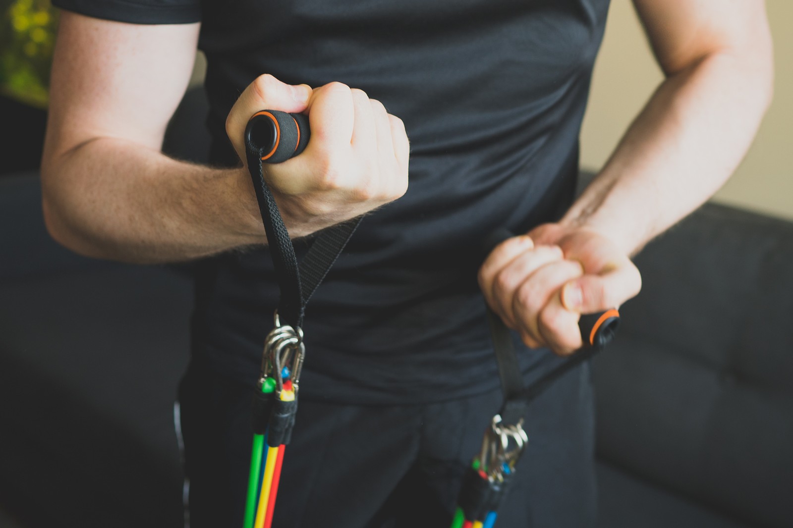 Man holding resistance bands with handles