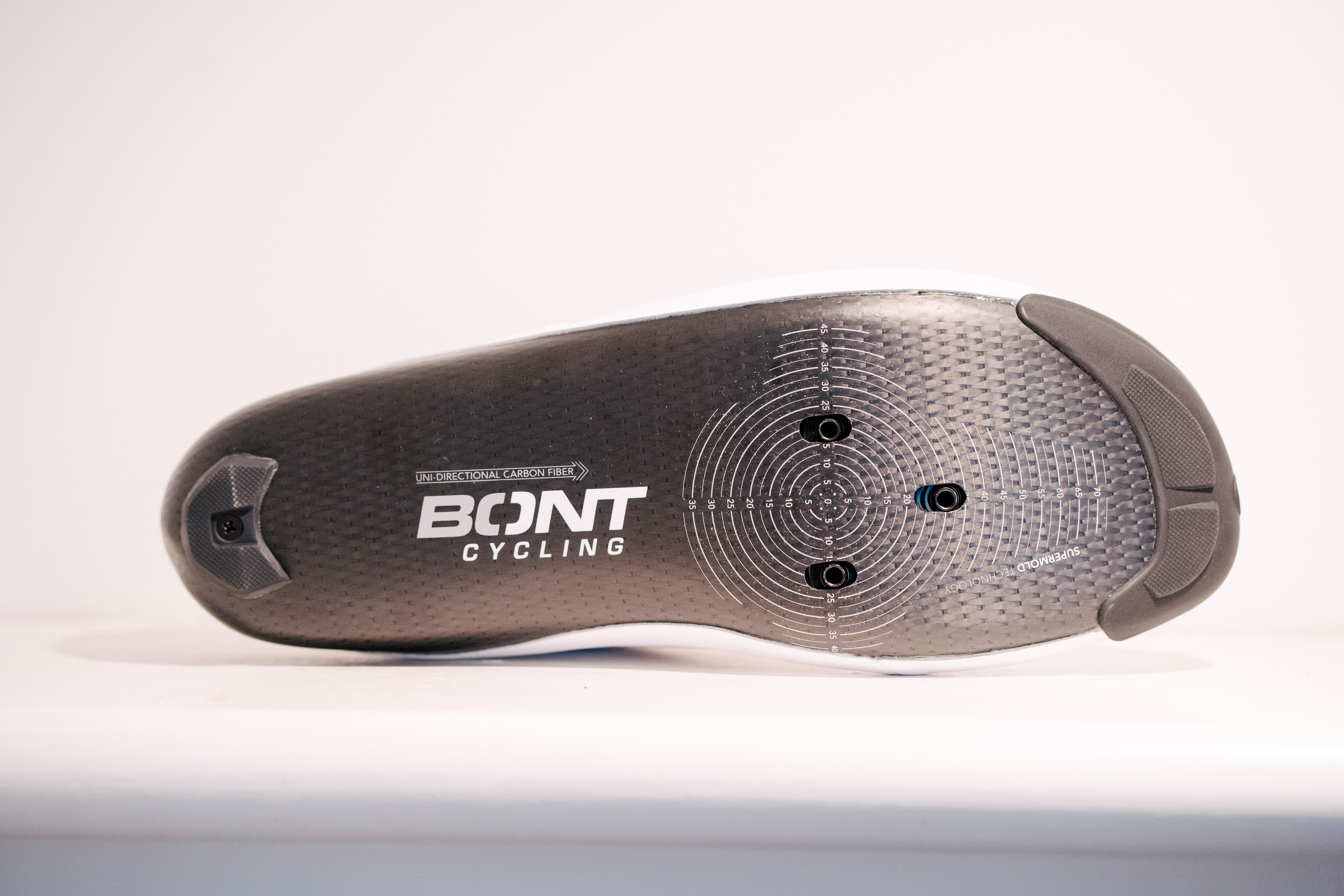 A white bicycle shoe on a shelf