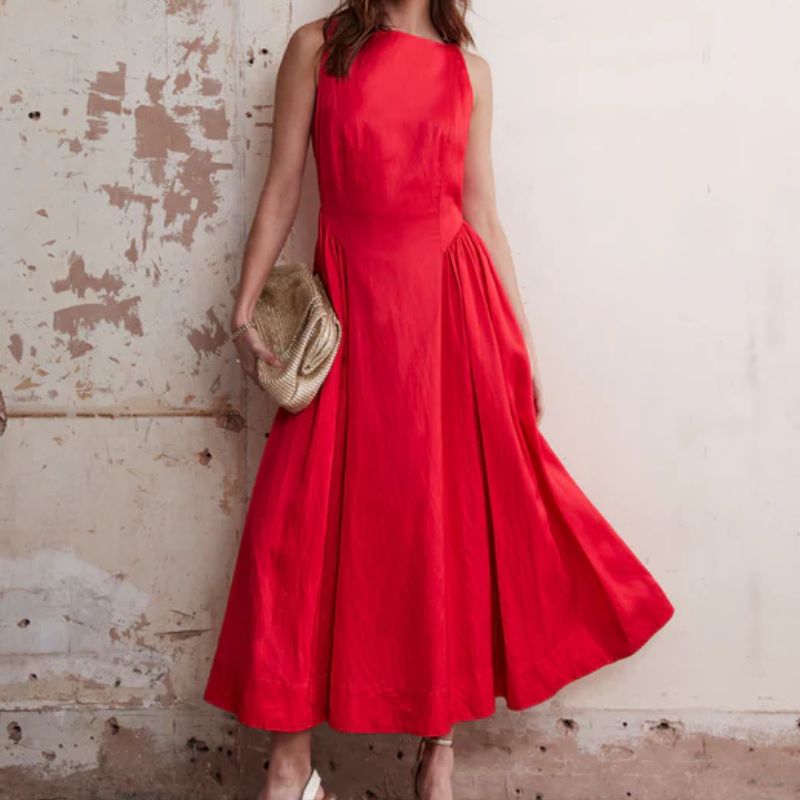 red dress and gold bag on a model