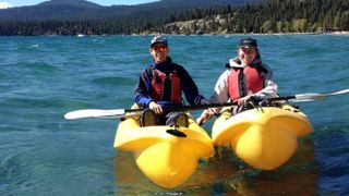 Cat and Matt Ellis kayaking on Lake Tahoe, California, USA