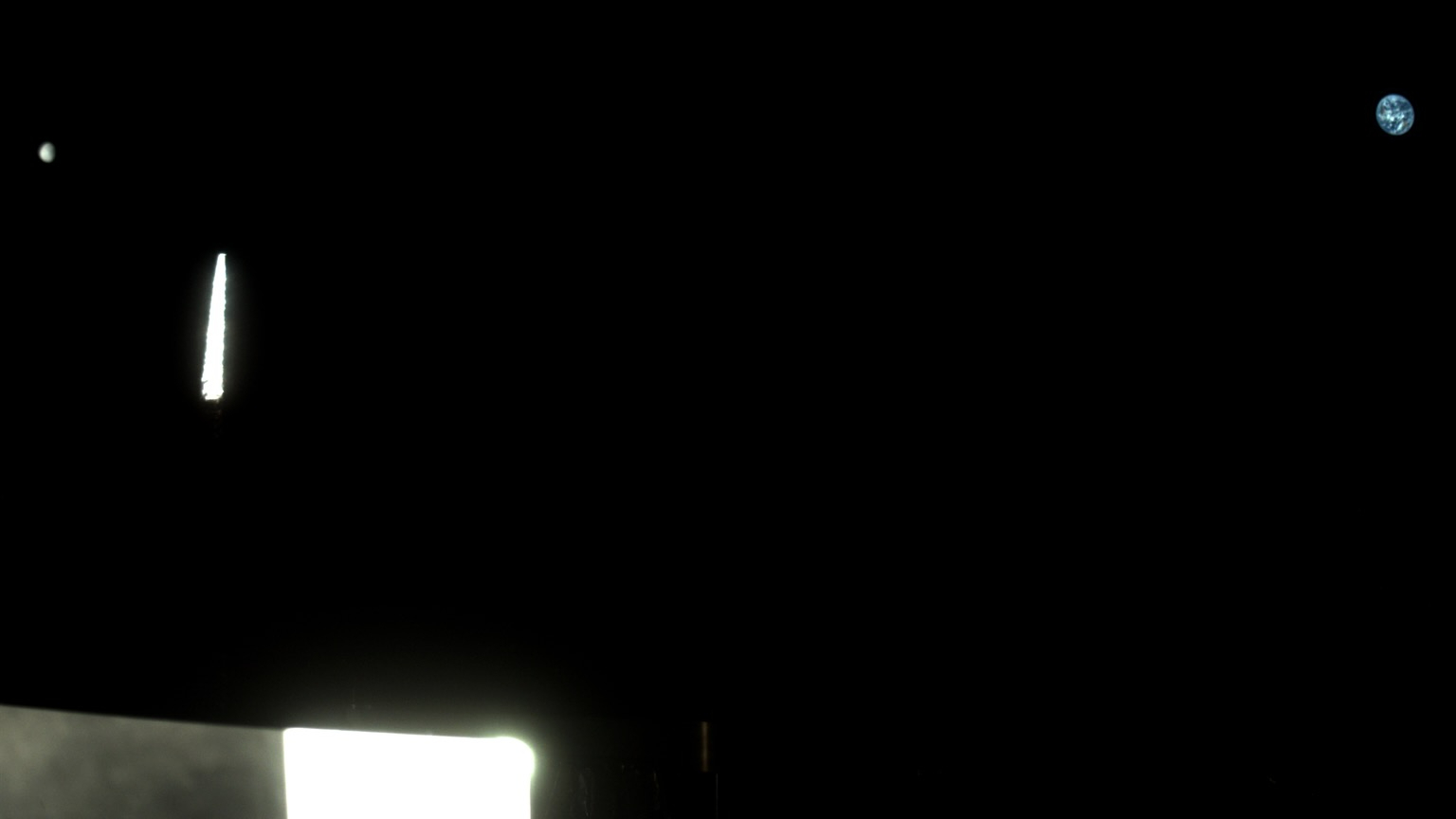 Two exposures from OSIRIS-APEX&amp;rsquo;s StowCam instrument were used in this image of the moon, on the far left, and Earth, on the far right. Light reflects off the spacecraft&amp;rsquo;s instruments in the foreground. OSIRIS-APEX was about 370,000 miles (595,000 kilometers) away from Earth when it captured this view on Sept. 24, 2025.