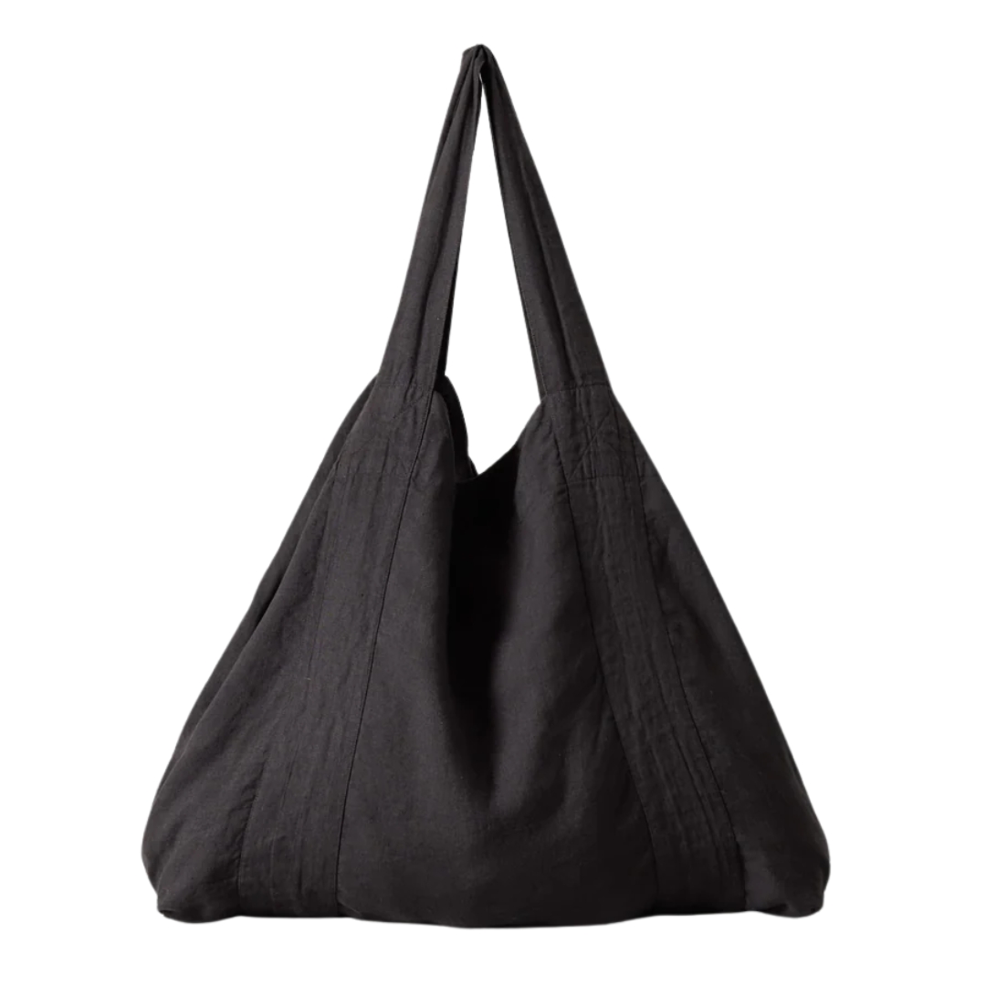 A soft, triangular-looking tote Garment Dyed Linen Bag in black fabric.