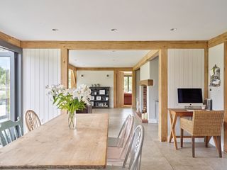 oak frame house with downlights around dining area