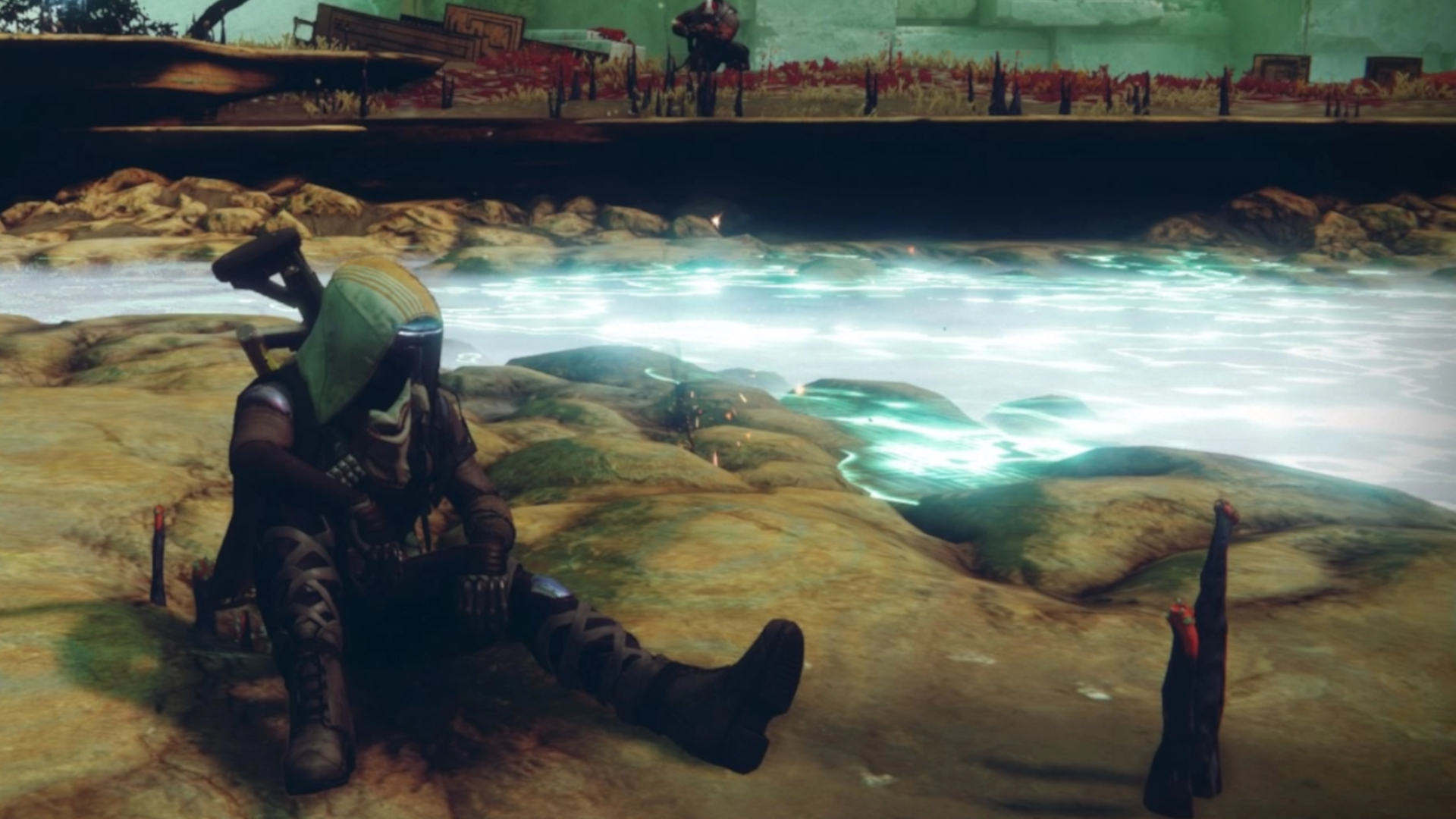 A Guardian sat on the shore by bright blue water in Destiny