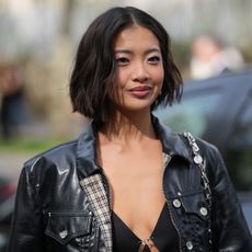 woman with short curled brown bob