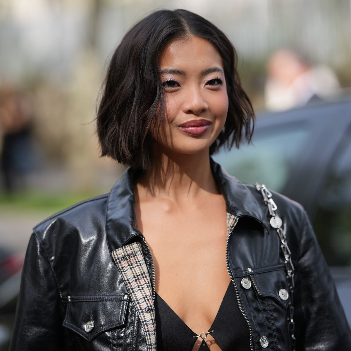 woman with short curled brown bob