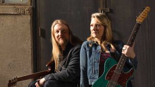 Derek Trucks and Susan Tedeschi pose with guitars