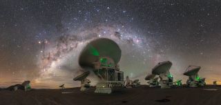 The arc of the Milky Way galaxy stretches over the Atacama Large Millimeter/submillimeter Array (ALMA) in northern Chile in this panoramic shot by European Southern Observatory photo ambassador Petr Horálek. Also visible in the night sky here are the Crux constellation (also known as the Southern Cross), located above and to the right of the nearest antenna, and the Carina Nebula, a reddish-pink emission nebula to the right of the Southern Cross.