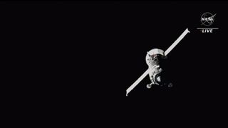 Russia's Progress 82 spacecraft with two rectangular solar wings deployed in the black of space.