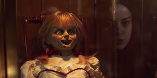 Annabelle Comes Home movie, doll in glass encasement in Warren artifact room