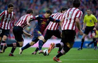 Lionel Messi runs through the Athletic Club defence to score for Barcelona at San Mames in La Liga in April 2013.