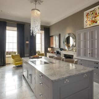 kitchen room with tile flooring and marble worktop