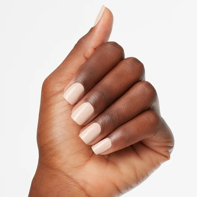 A hand wearing OPI's Tiramisu For Two nail polish.