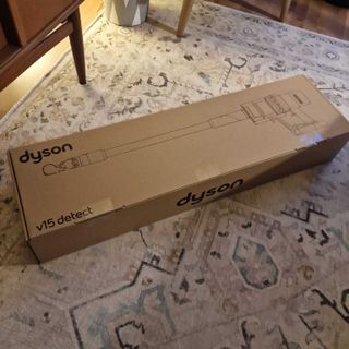 The Dyson V15 Detect Absolute in its box