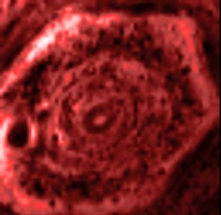This still image from an infrared movie from NASA's Cassini mission shows the churning of the curious six-sided jet stream at Saturn's north pole known as "the hexagon." The image was obtained on June 14, 2013.