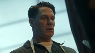 Chris looking at Alt Dimension Peacemaker's body being burned in Peacemaker Season 2