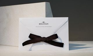 White envelope with a black bow