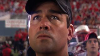 Kyle Chandler watches from the sidelines in Friday Night Lights.
