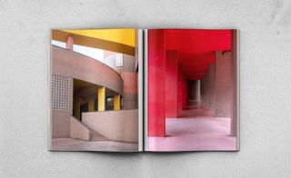 Modernists Estates Europe book open at images of a building with yellow and concrete curved walls and a passageway with concrete columns and red-painted columns and ceiling