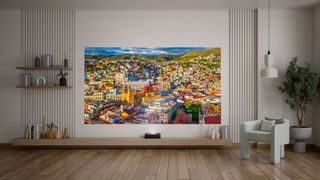 A lifestyle photo of the Optoma Photon Go projecting a (most likely rendered) image onto the wall behind it in a normally lit room during the day.