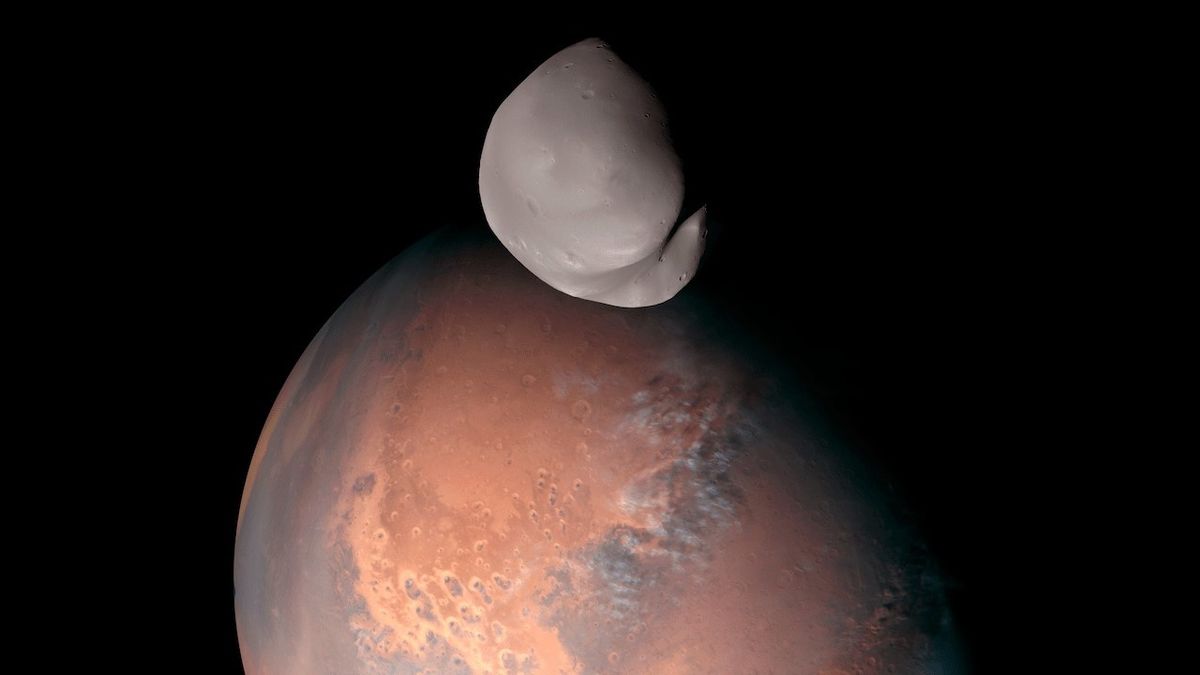 A shot of Deimos against a backdrop of the Red Planet.