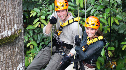 Prince William, Duke of Cambride and Catherine, Duchess of Cambridge abseil through the rainforest in Danum Valley Research Center in Danum Valley on the island of Borneo on September 15, 2012