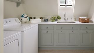 light blue utility room with washing machines