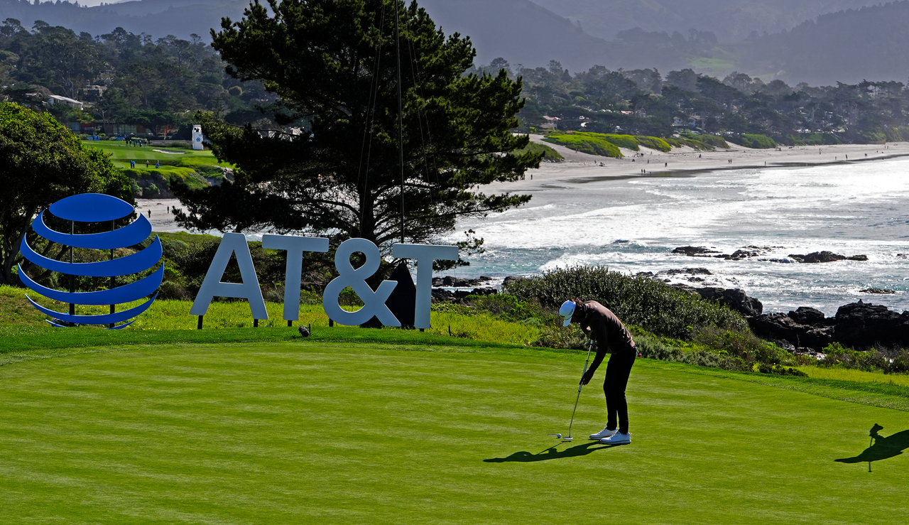 Akshay Bhatia hits a putt at Pebble Beach