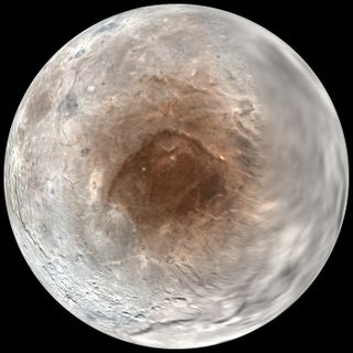 Pluto's largest moon Charon has a red spot at its north pole that may be caused by the atmosphere of Pluto, scientists announced on Sept. 14, 2016. This view shows a view looking down on Charon's red spot as seen by NASA's New Horizons spacecraft during i