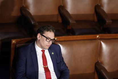 Rep. George Santos sits alone