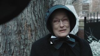 Meryl Streep, as a Catholic nun, cries underneath a tree in Doubt