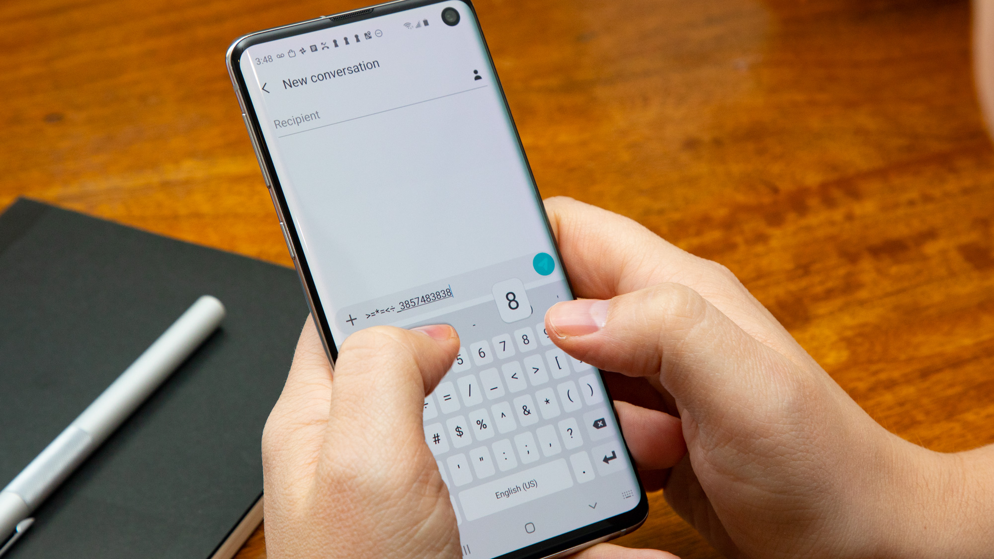Someone typing a message on a Samsung Galaxy S10