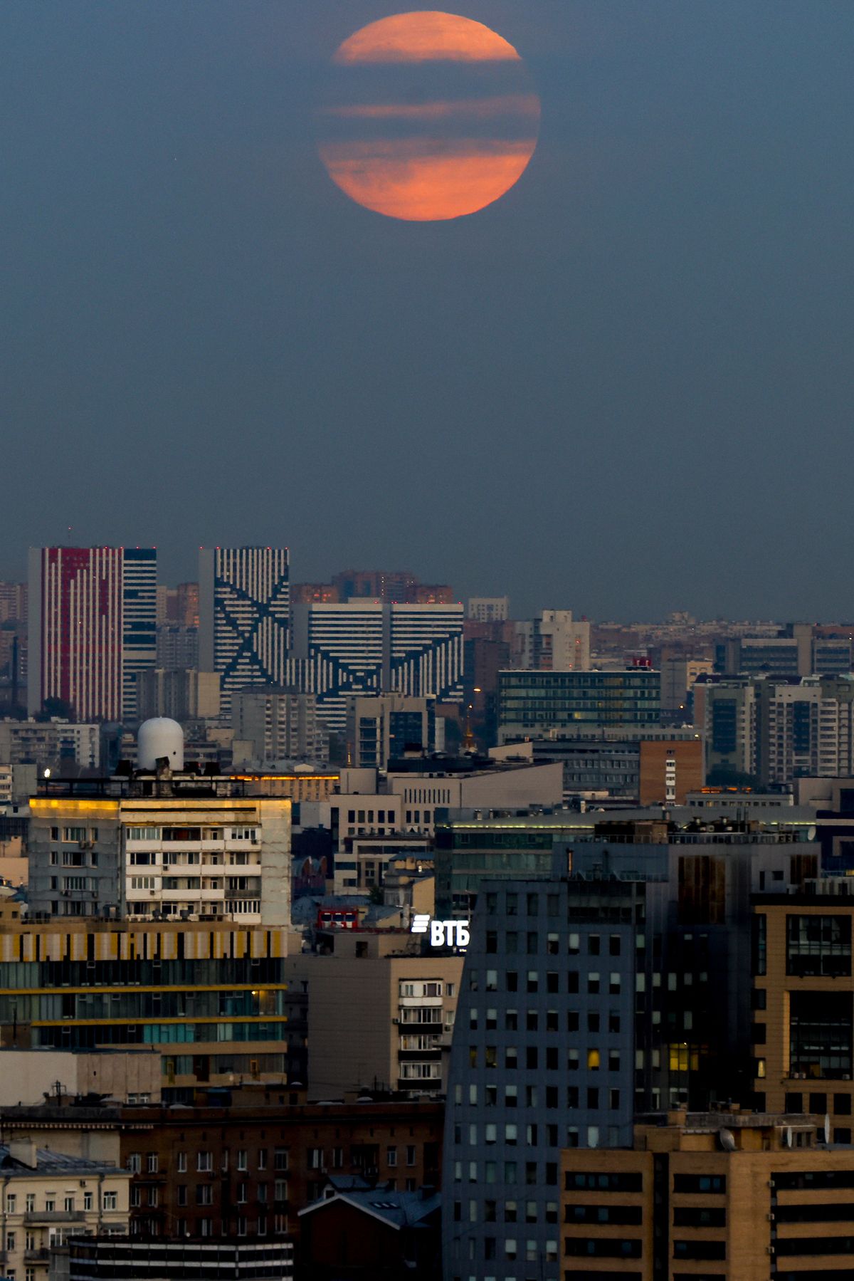 Full moon illuminating the night rises over the city in Moscow, Russia on October 08, 2022.