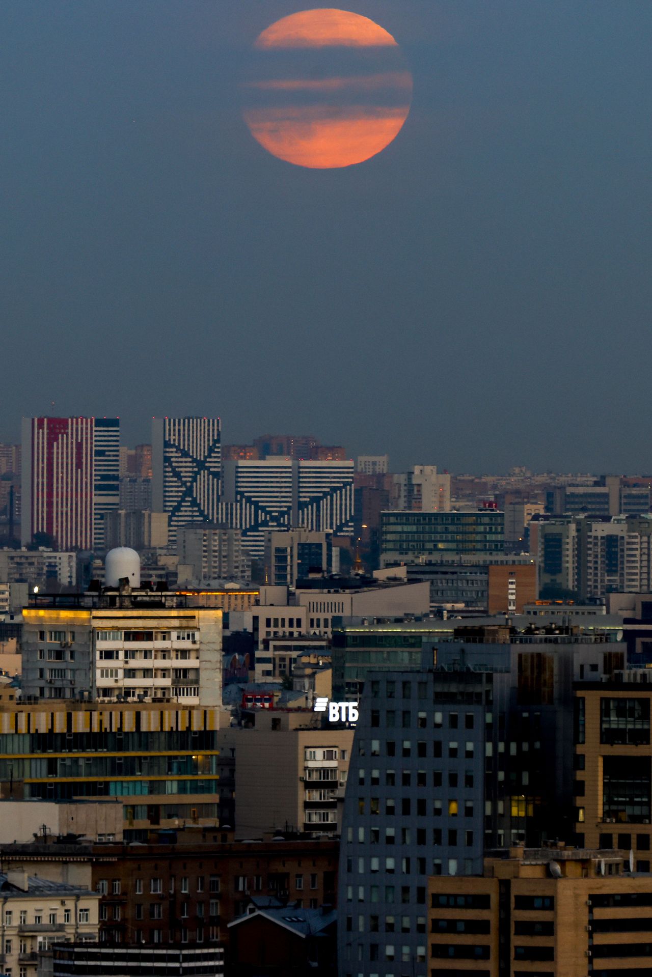 Full moon illuminating the night rises over the city in Moscow, Russia on October 08, 2022.