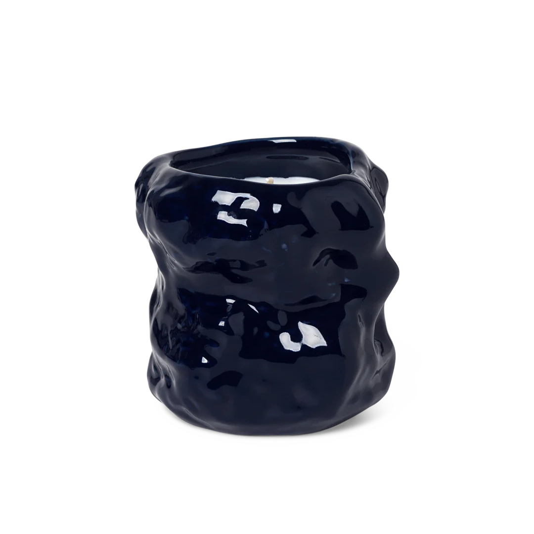 scented candle in blue sculptural jar
